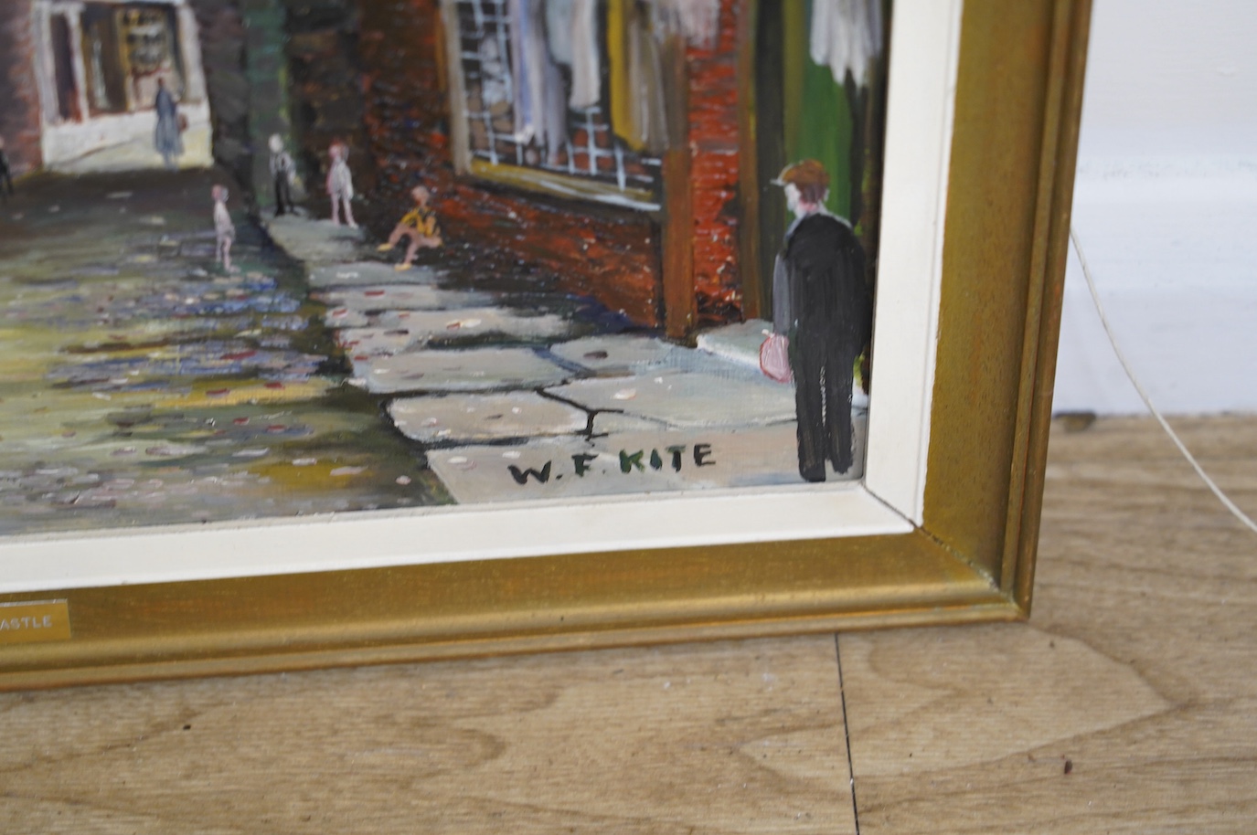 W F Kite (20th. C), oil on board, ‘Old Newcastle street scene’, signed, 39 x 44cm. Condition - good